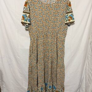 Prairie Dress in a medium ditsy floral print, cap sleeve and tiered midi.